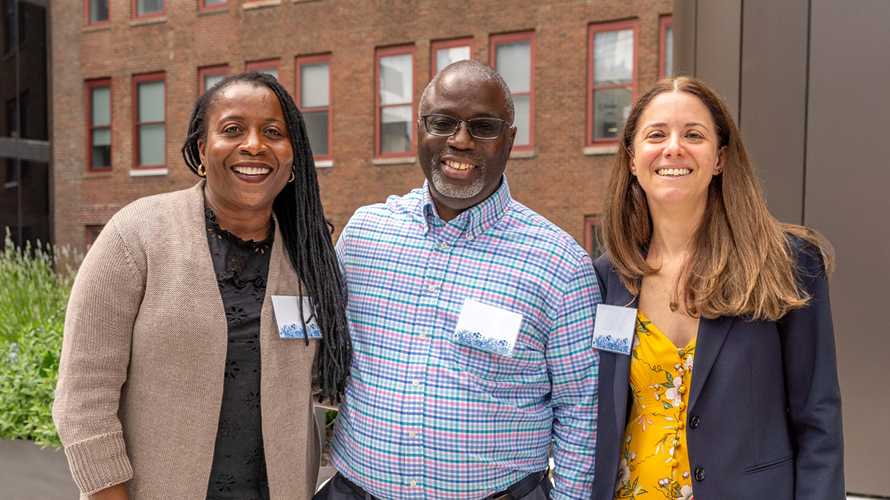 Three members of the W. P. Carey team smiling
