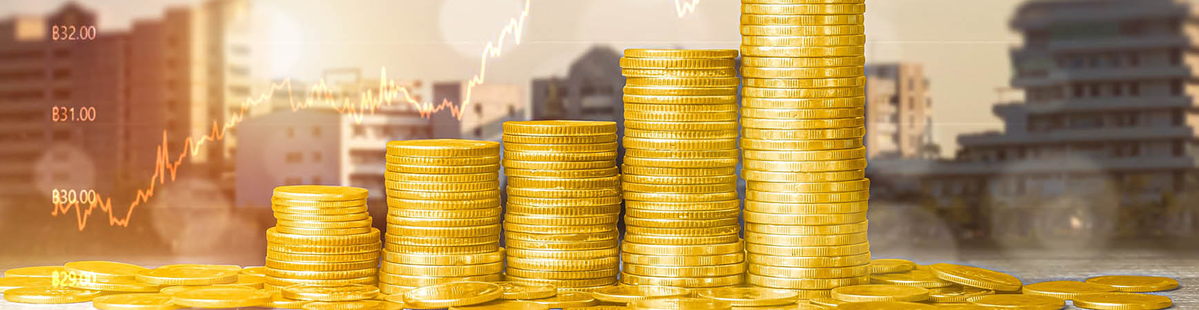 Photo of coins in a stack with buildings behind it