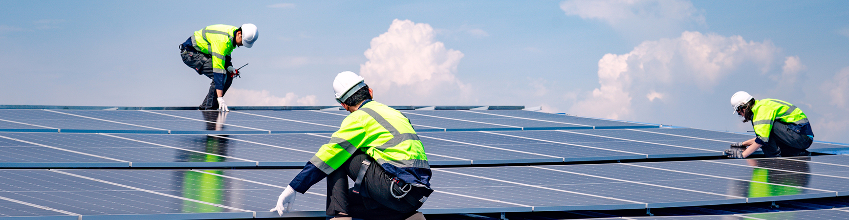 Photo of people working on solar roof