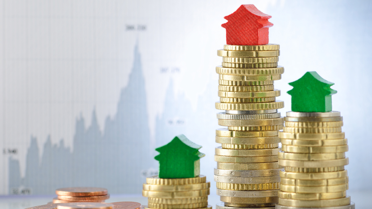 Image of red and green houses on top of stacks of coins