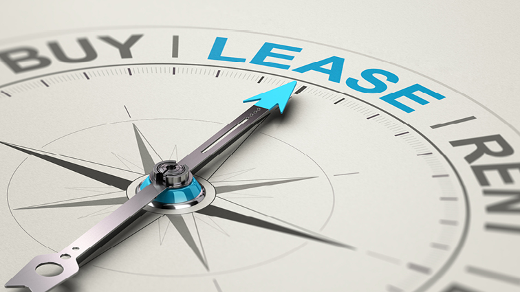 Image of compass pointing toward the word lease