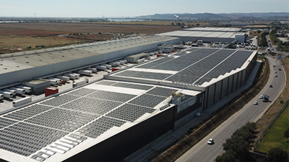The exterior of a W. P. Carey owned facility with solar panels on the roof