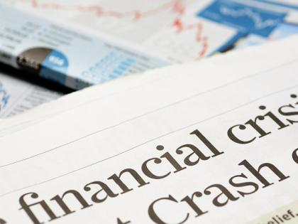 Newspapers with headlines about a financial crises
