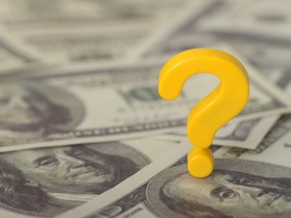 Pile of money with a yellow question mark
