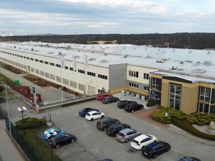 Exterior of a large industrial facility owned by W. P. Carey and leased to Purmo Group