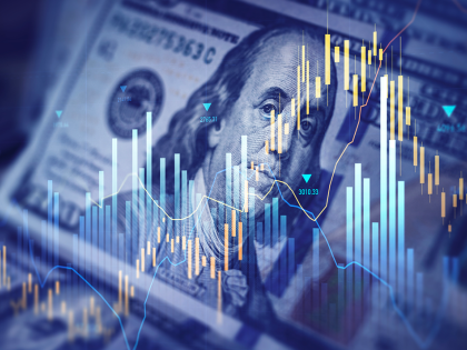 Photo of money and bar graph 