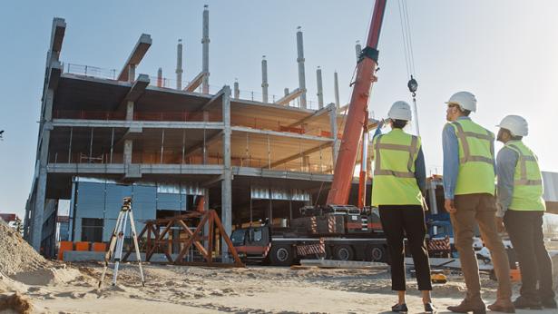 W. P. Carey's project management team looking at building development being built and expanded