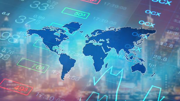 A global map overlayed on stock information to represent the Corporate Capital Outlook Report