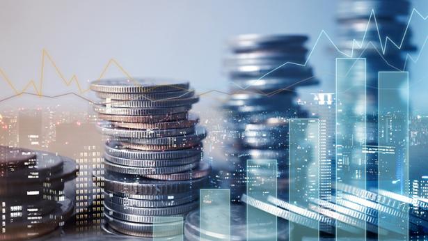 Double exposure of graph and rows of coins, both trending upwards to represent upward trend of success in the net lease retail sector