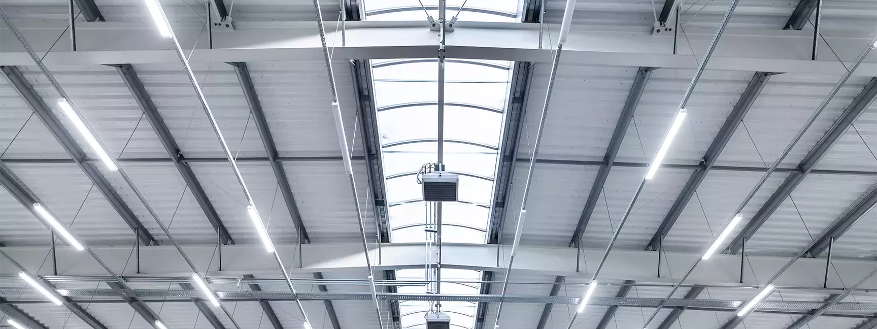 The ceiling of a warehouse with LED lights