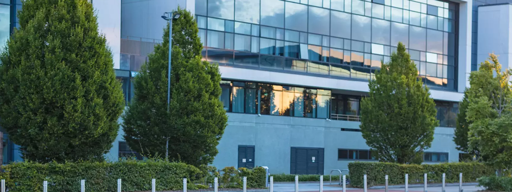The outside of a building with bright green grass