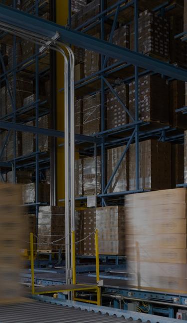Inside of a W. P. Carey (NYSE: WPC) net-leased commercial manufacturing property with a conveyer belt