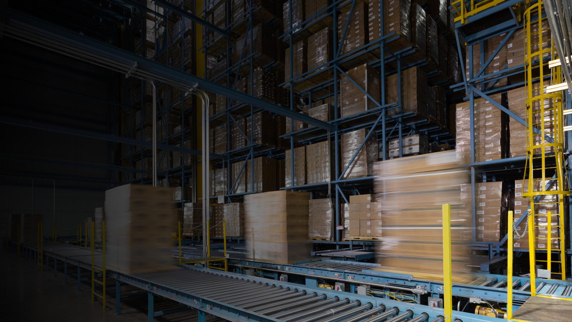 Inside of a W. P. Carey (NYSE: WPC) net-leased commercial manufacturing property with a conveyer belt